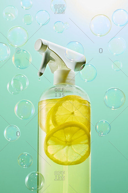 Yellow cleaning spray bottle with bubbles