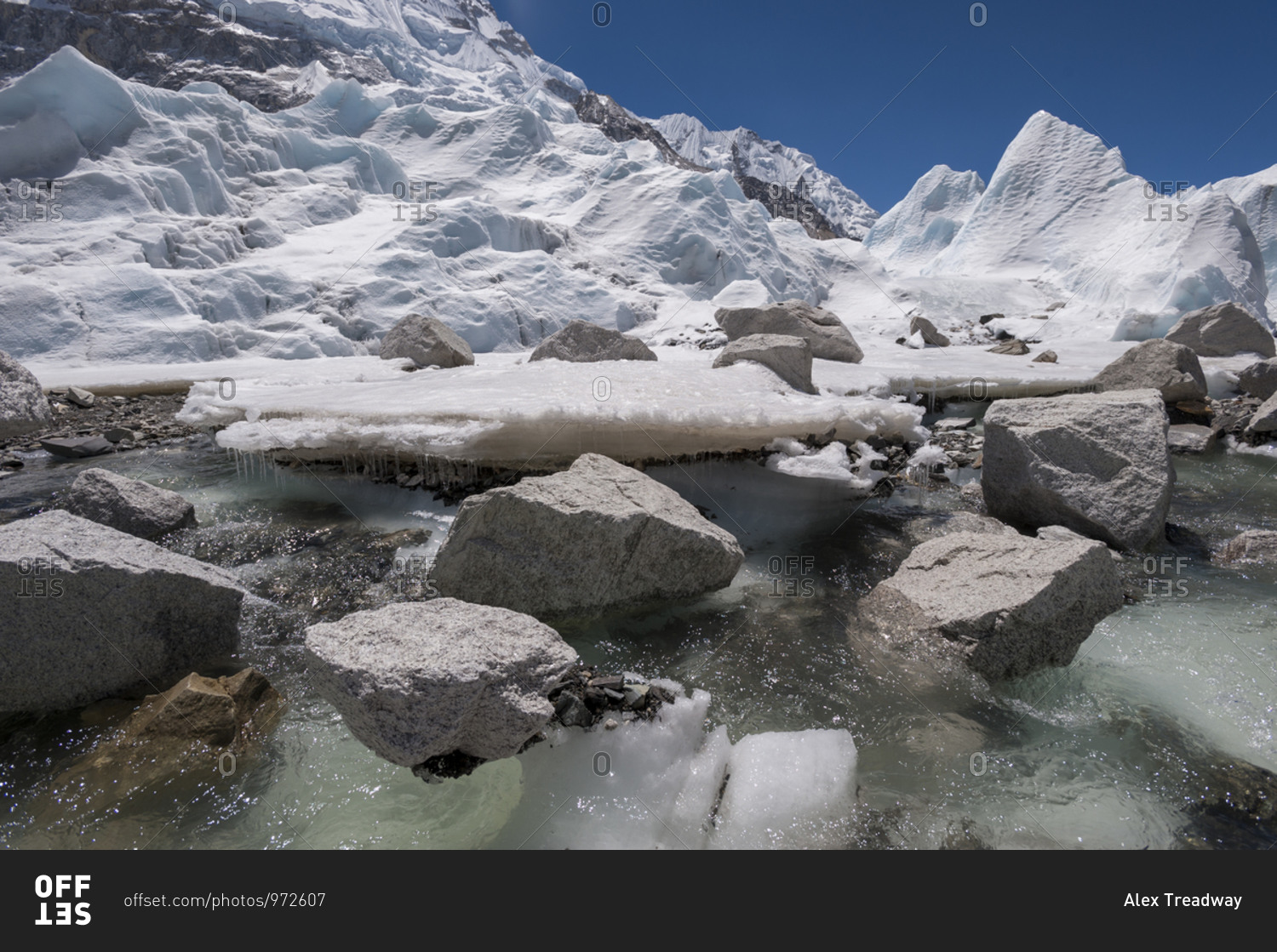 Glacial melt water forms under the Khumbu glacier as the ice\
melts stock photo - OFFSET