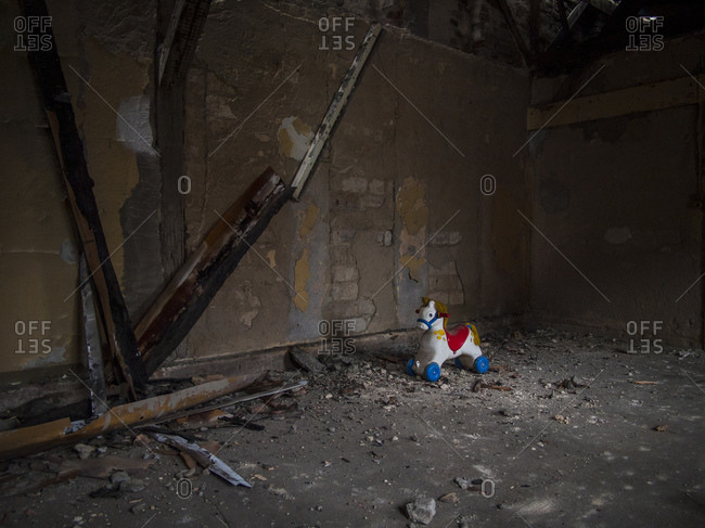 Toy horse in an old dilapidated house