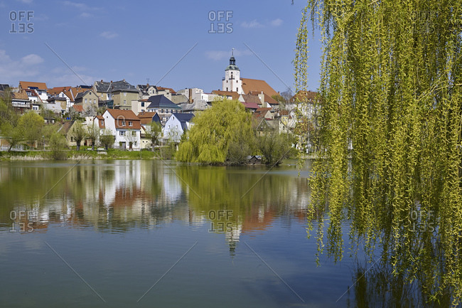 Panoramic view over the bathing pond to the old town with the church St. Marien, Ronneburg, Thuringia, Germany