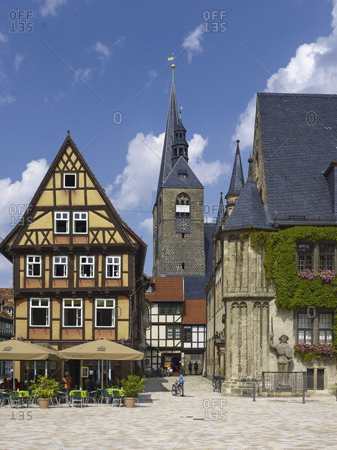August 8, 2014: Market with town hall and town church St. Benedikti, view in the Hoken, gastronomy at the market, Quedlinburg, Saxony-Anhalt, Germany