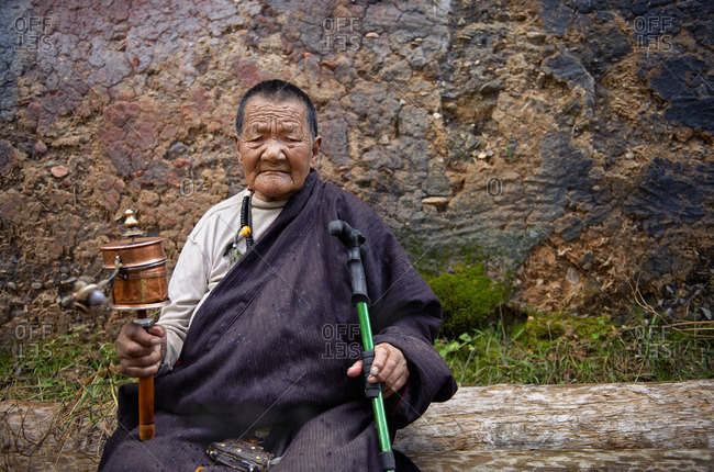 September 23, 2011: Tibetans are very devote buddhists and at all ages they spend long hours reciting their mantras using their praying wheels. Remote Tibetan plateau