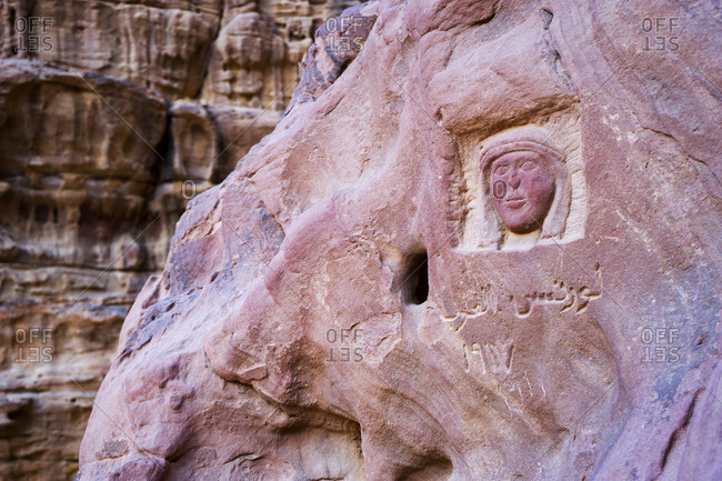 A prehistoric carving and engraving on a rock face in Wadi Rum desert