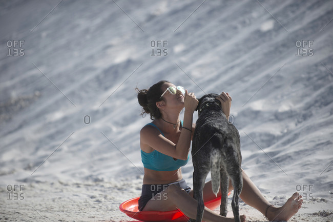Woman with dog, White Sands National Monument, New Mexico, USA