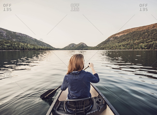 Woman canoeing in Jordan Pond, Acadia National Park, Maine, USA