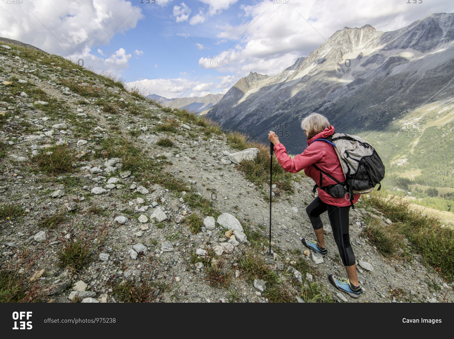 View of woman climbing mountains, Valais, Switzerland