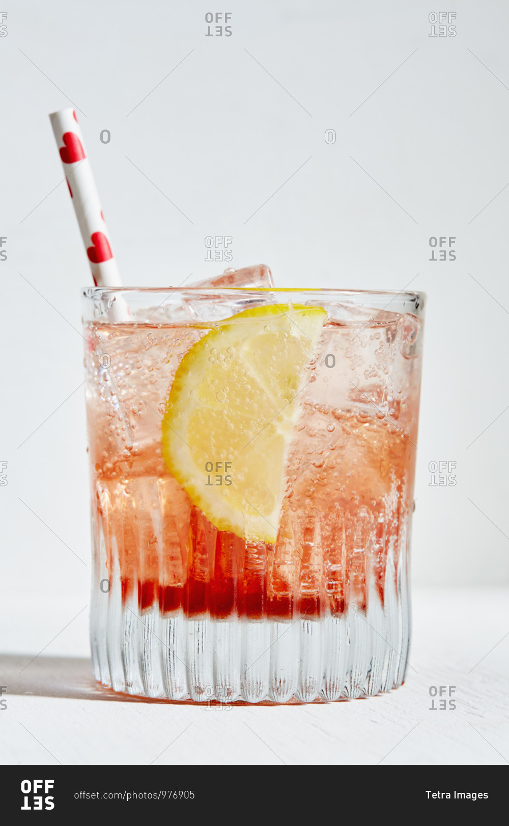 Aperol spritz with lemon and straw