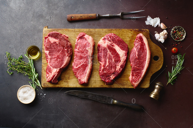 Browse Free HD Images of Raw Red Meat Lays In A Wooden Cutting Board