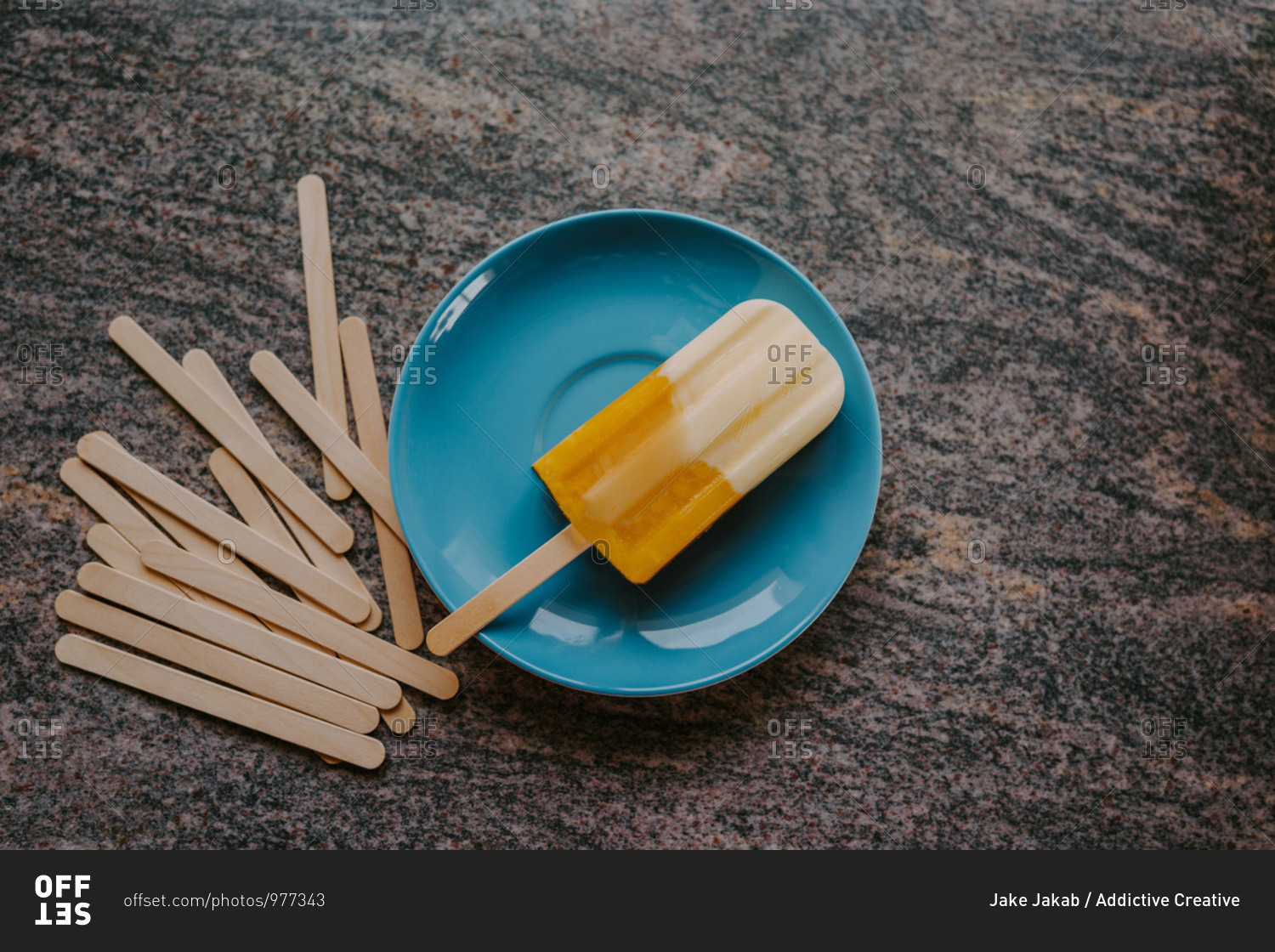 Top view of delicious fruit popsicle placed on table with wooden sticks