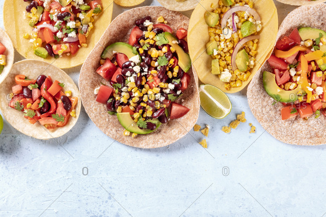 Vegetarian Mexican food, a flat lay. Tacos with vegetables, top shot with a place for text