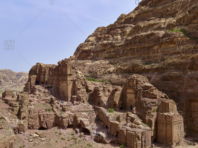 Rock wall at the outer Siq with tomb of Uneishu in the rock city of Petra, Jordan, Middle East,