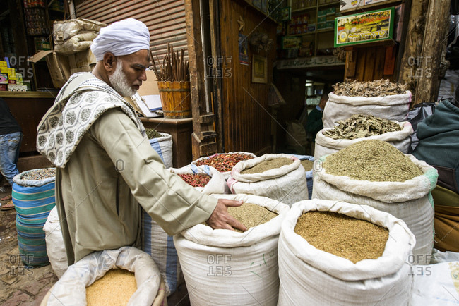 March 18, 2014: Man stands at a spice stall, Cairo, Egypt