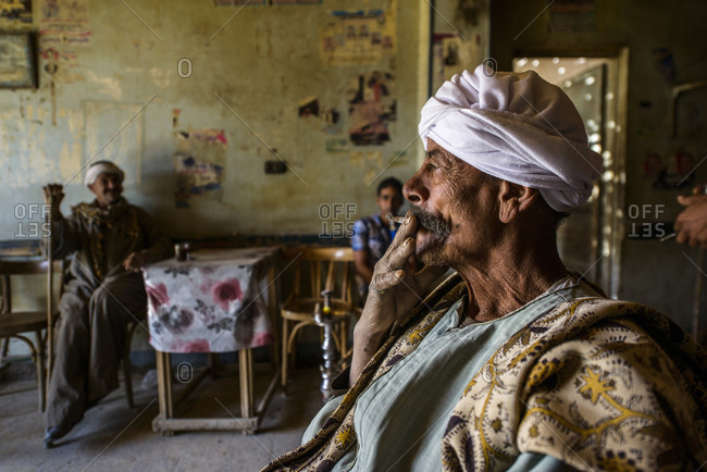 March 31, 2014: Sahara desert man in traditional tea house with shisha, Farafra oasis, Egypt