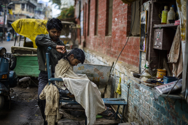 March 1, 2014: Barbers on the streets of Varanasi, India