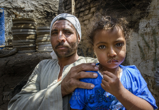 April 8, 2014: Father and daughter at home in a suburb of Luxor, Egypt