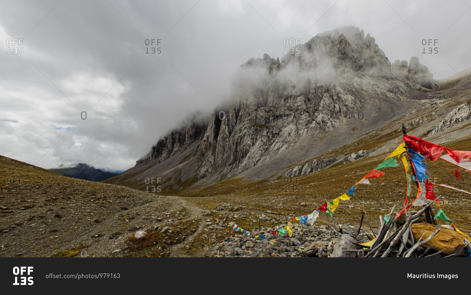 Remote mountain pass on the Tibetan plateau, indicated by Tibetan prayer flags, in Sichuan province, China