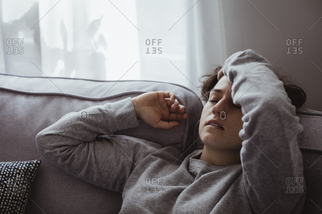 Close-up of woman having headache at home