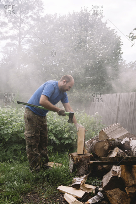 Man chopping wood, Tikhvin, Saint Petersburg, Russia