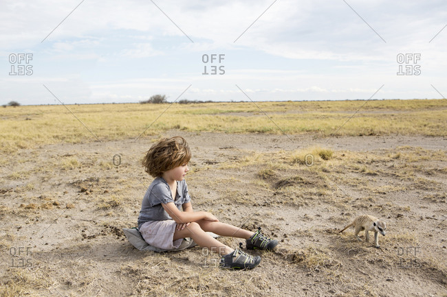 5 year old boy looking at Meerkats, Kalahari Desert, Makgadikgadi Salt Pans, Botswana
