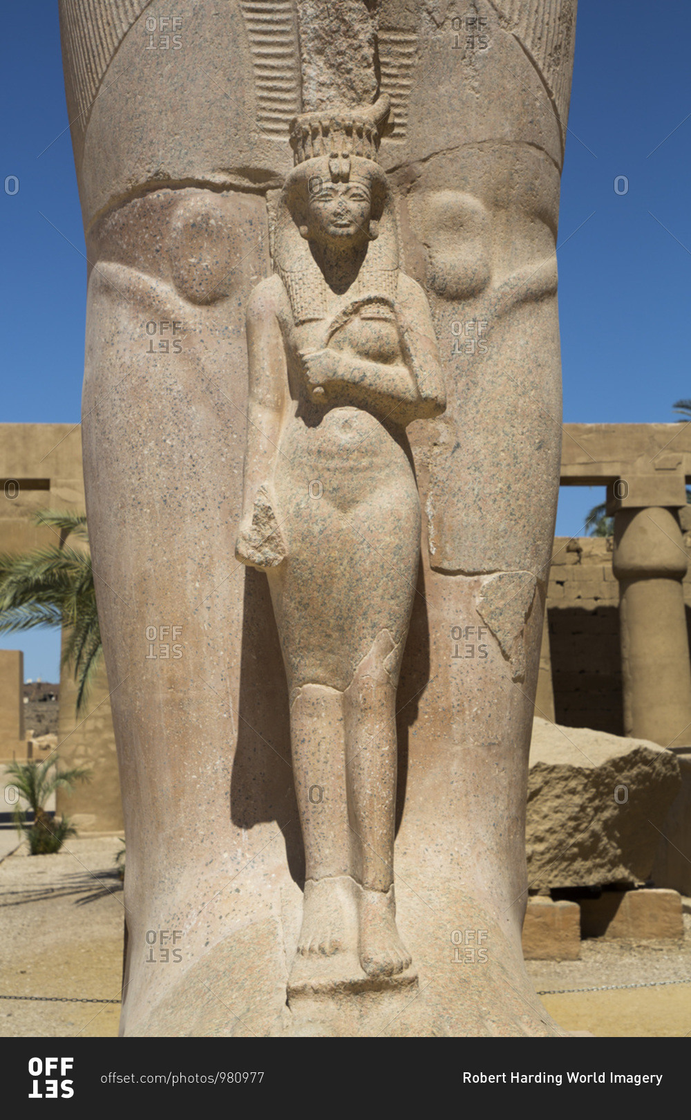 Statue of Nefetari, at base of statue of Ramses II, Great Court, Karnak Temple Complex, UNESCO World Heritage Site, Luxor, Thebes, Egypt, North Africa, Africa
