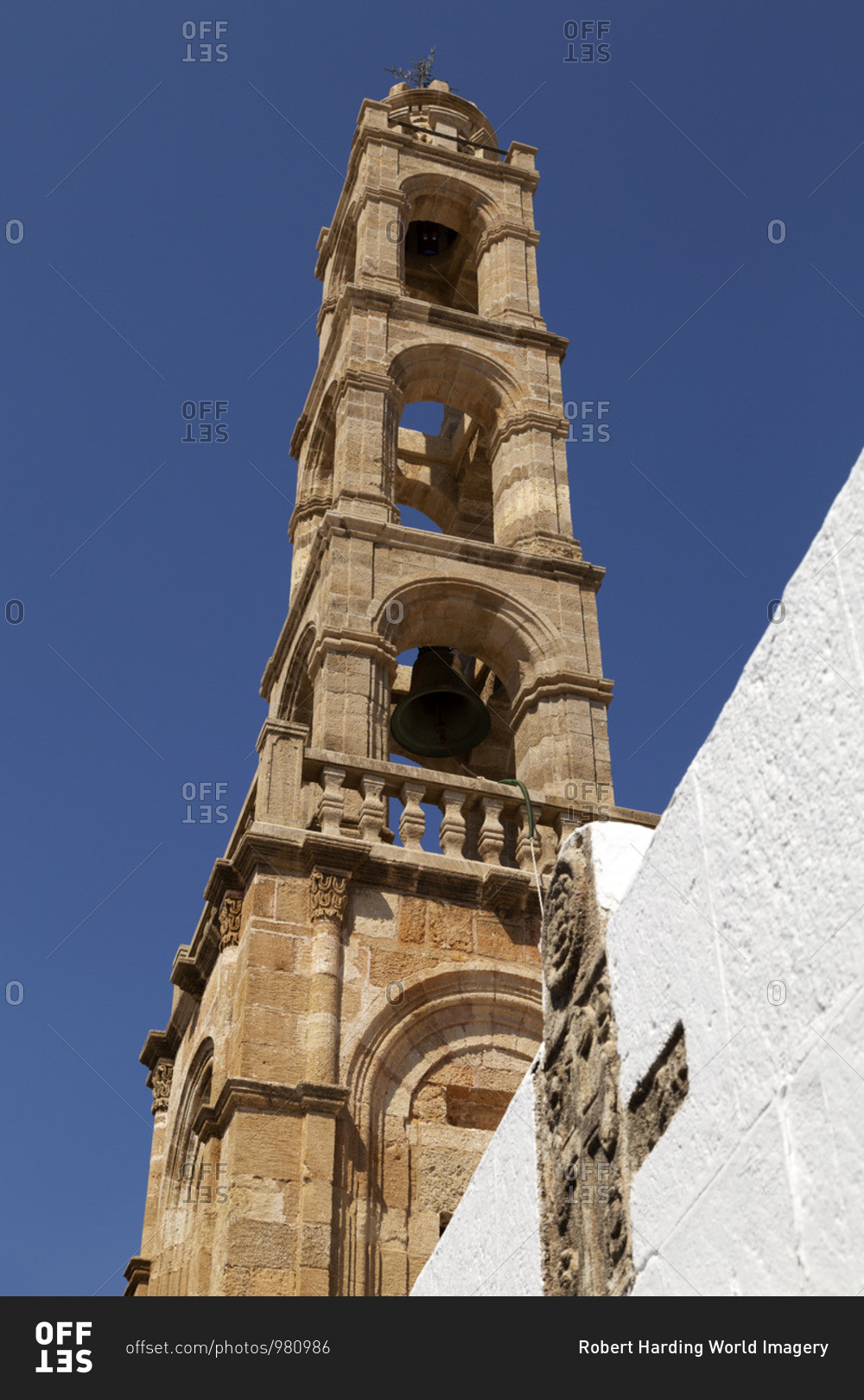 Stone bell tower of the Church of the Panagia, a Greek Orthodox place of worship on Lindos on Rhodes, Dodecanese, Greek Islands, Greece, Europe