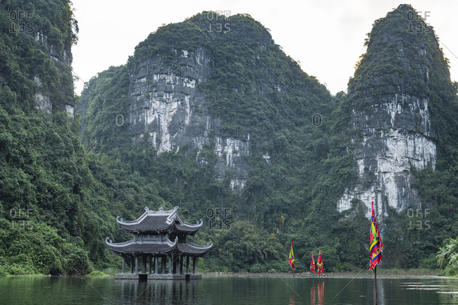 Temple standing between the scenic limestone mountains of Trang An Landscape Complex, UNESCO World Heritage Site, Vietnam, Indochina, Southeast Asia, Asia