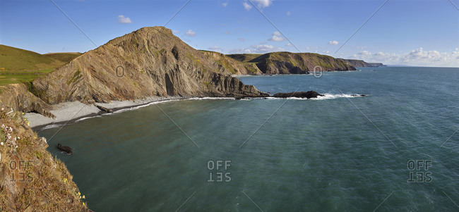 Rugged cliffs along southwest England's Atlantic coast, seen in calm summer weather, near Hartland Quay, in Devon, England, United Kingdom, Europe