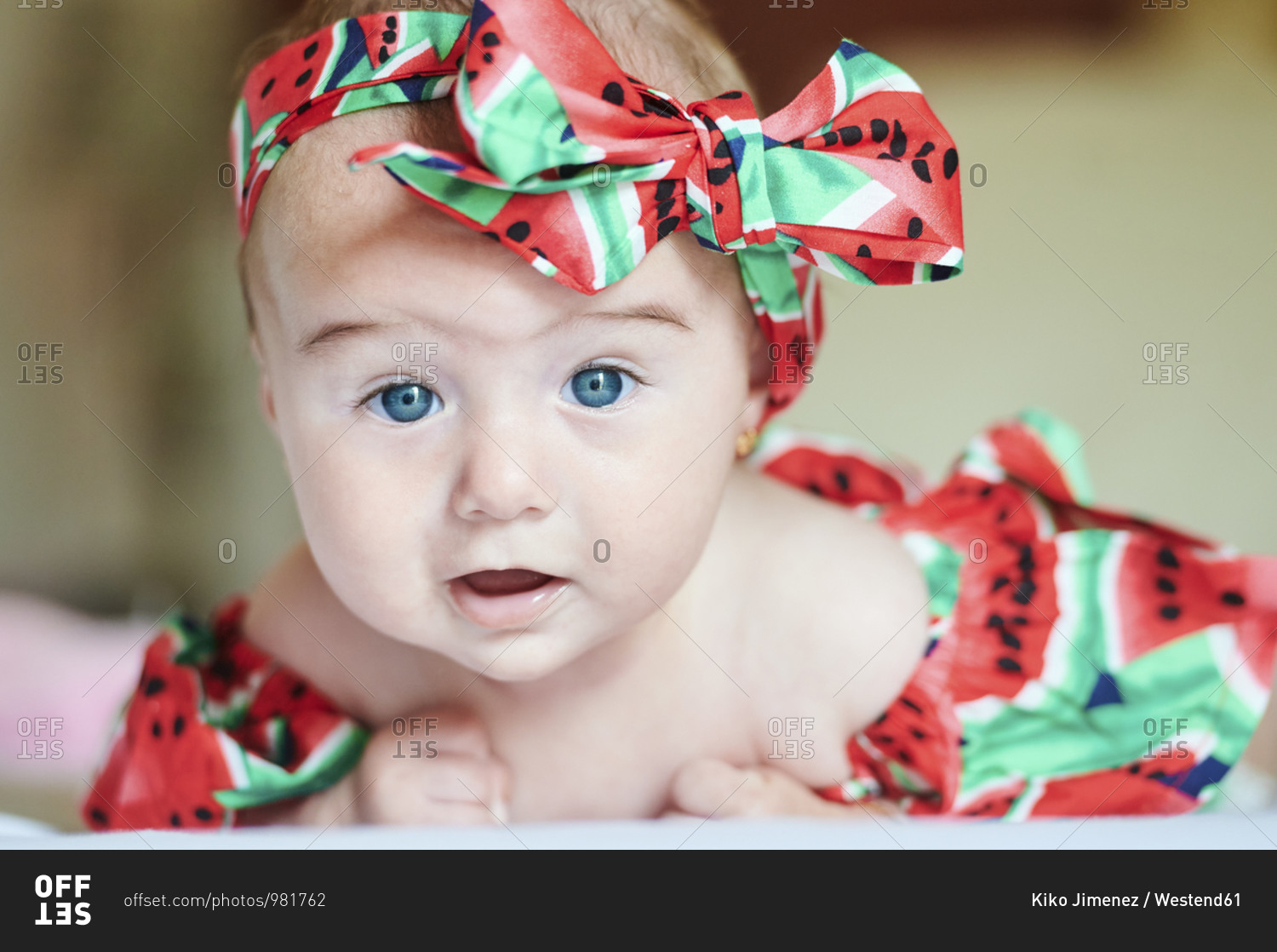 Portrait of dressed baby girl with hair-band