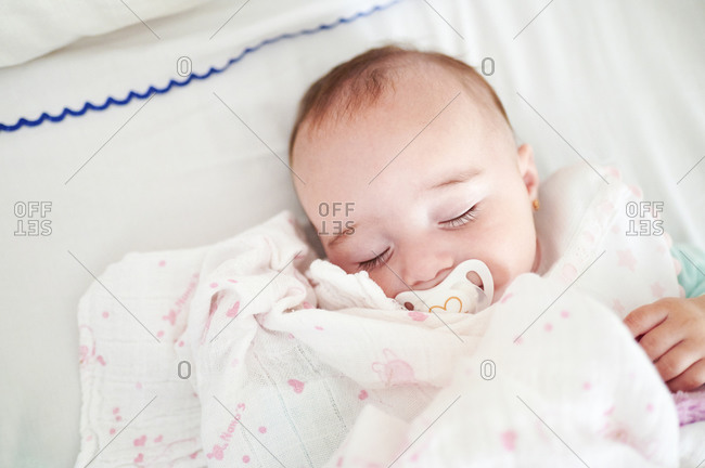 Portrait of sleeping baby girl with pacifier