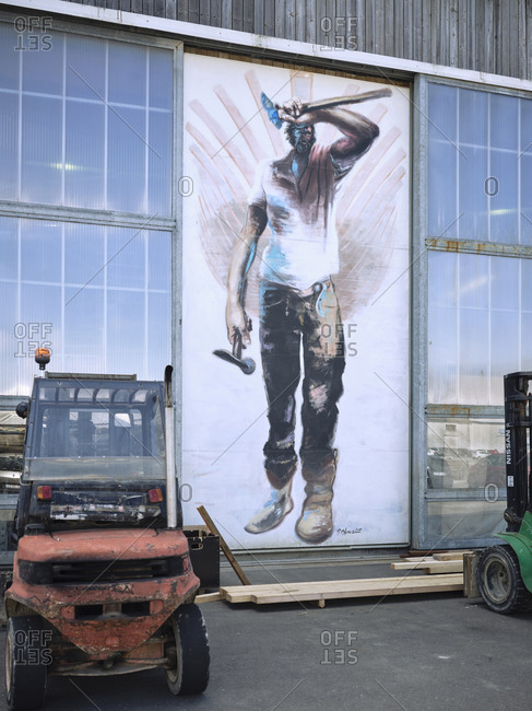 May 5, 2019: Graffiti of a winged worker at a shipyard in Brest in Brittany.