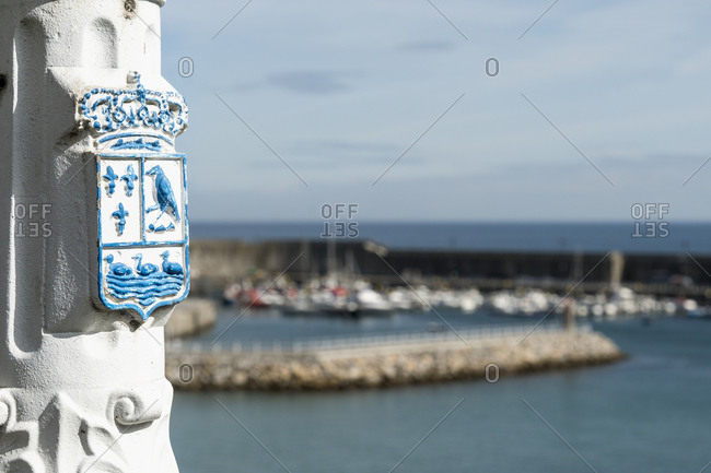 Spain, north coast, Asturias, Lastres, picturesque fishing village, harbor, coat of arms