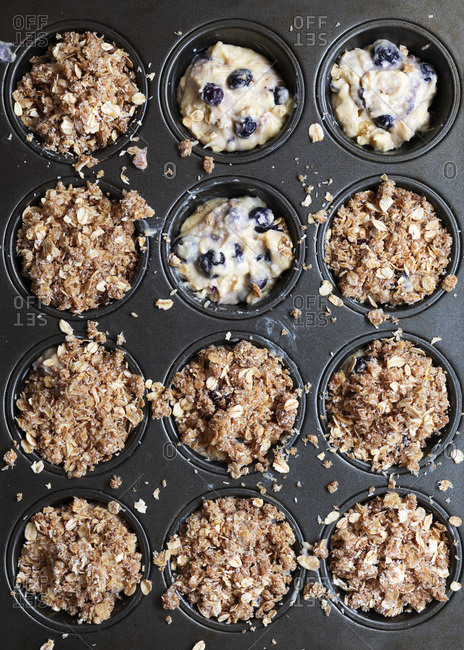 Blueberry muffin batter with oat crumble.