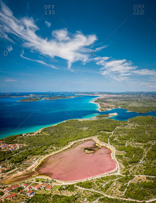 Aerial view of a pink lake on the shoreline in Sibenik, Croatia