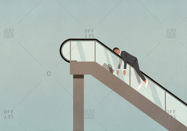 Exhausted businessman on ascending escalator
