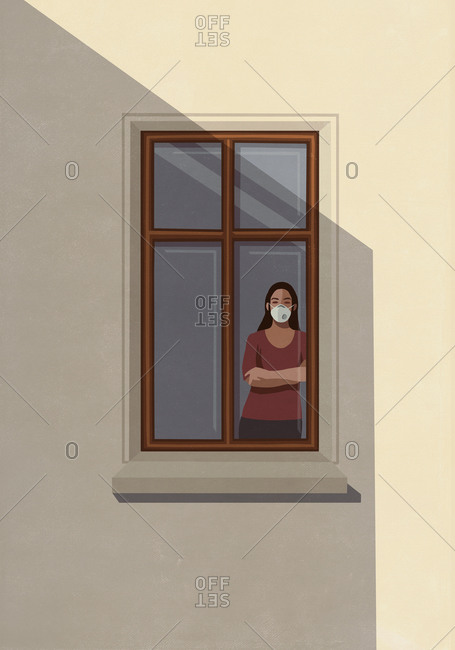 Portrait woman in protective mask standing at apartment window