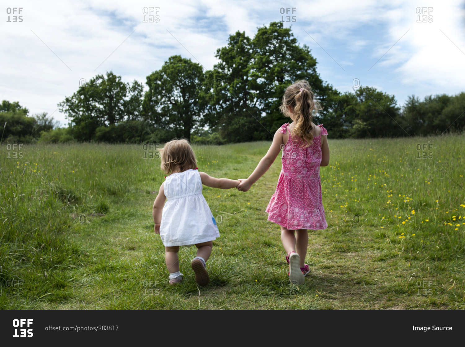 little girl walking away holding hands