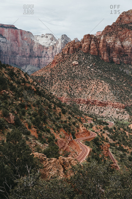 Winding road and steep red cliffs of Zion Canyon, Utah