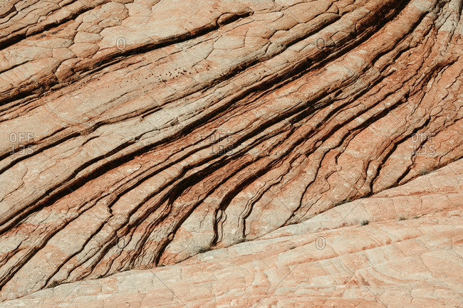 Diagonal lines of petrified sand dunes create texture and shadow