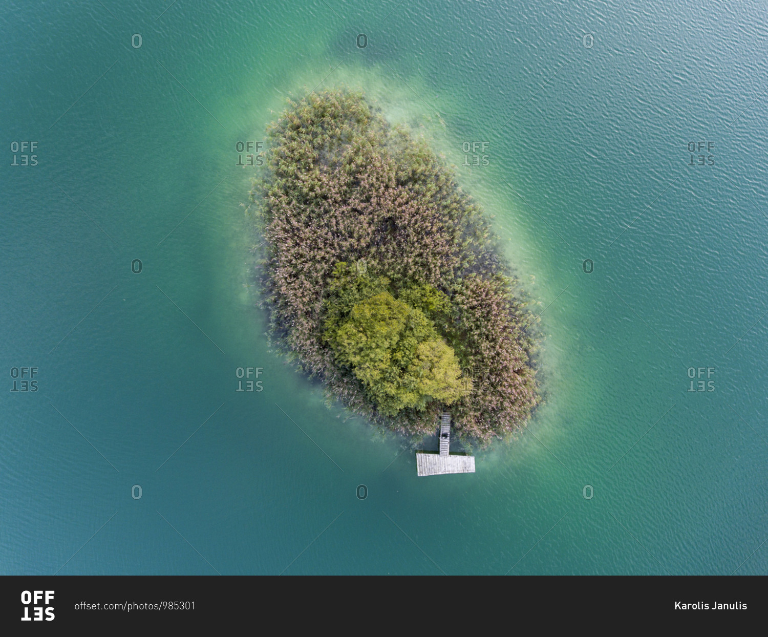 Small island with boat dock in the lake