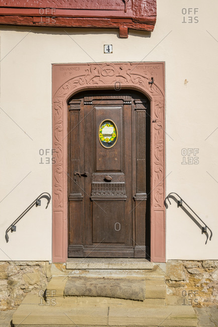 July 9, 2016: Historic front door in the old town of Meisenheim am Glan, well-preserved medieval architecture in the north Palatinate mountains, Germany