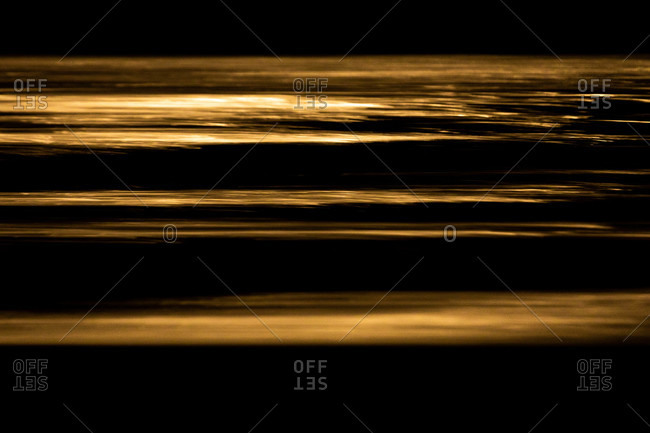 Abstract view of ocean waves in golden tone
