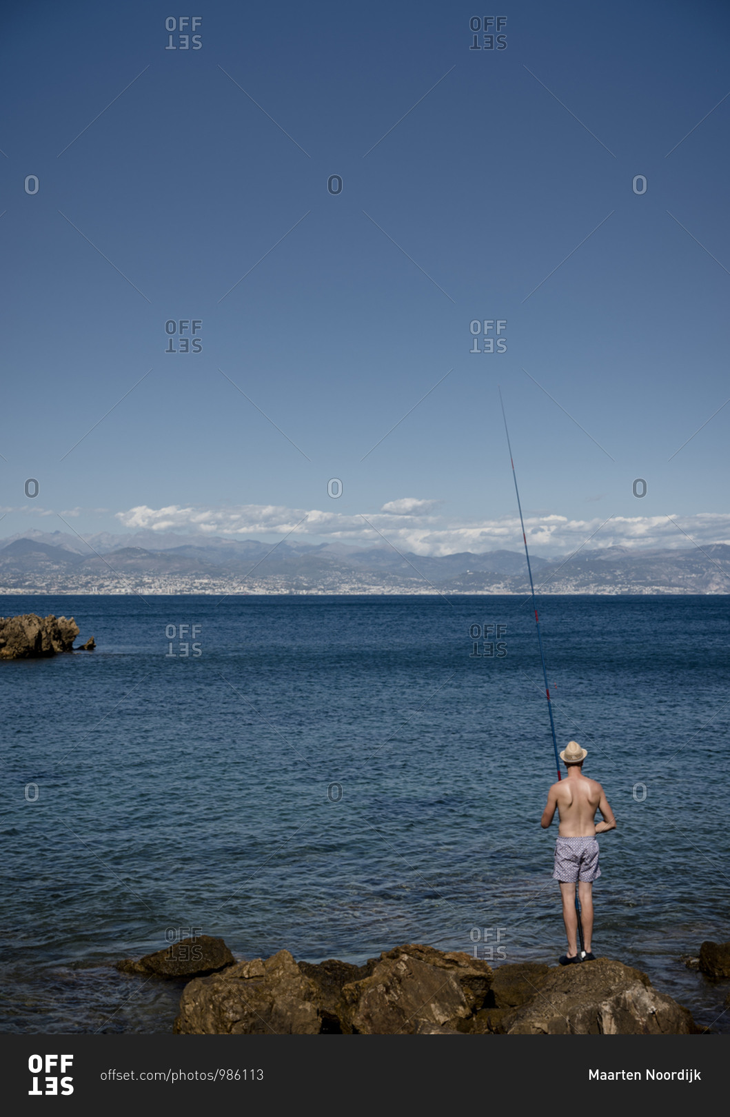 Fishing in the mediterranean sea under the sun near Antibes on the d\'Azur in France.