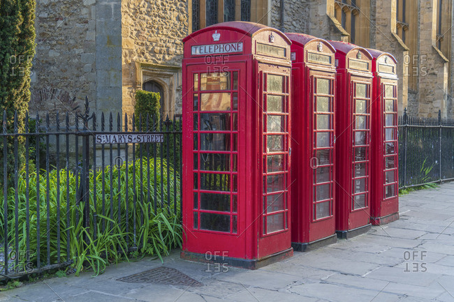April 21, 2020: UK, England, Cambridgeshire, Cambridge, Market Square, St. Mary's Street, Great St. Mary's Church, Traditional Telephone Boxes