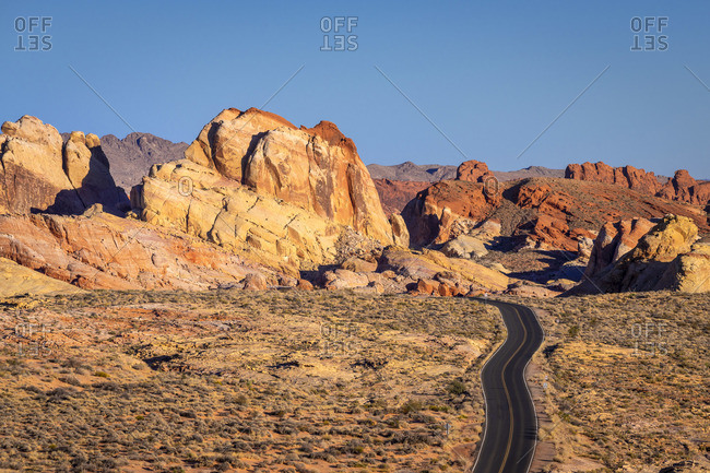 White Domes Road leading to white rock formations after sunrise, Valley of Fire State Park, Nevada, Western United States, USA
