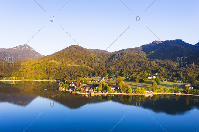 Germany- Bavaria- Kochel am See- Drone view of village on shore of Lake Walchen at springtime dawn