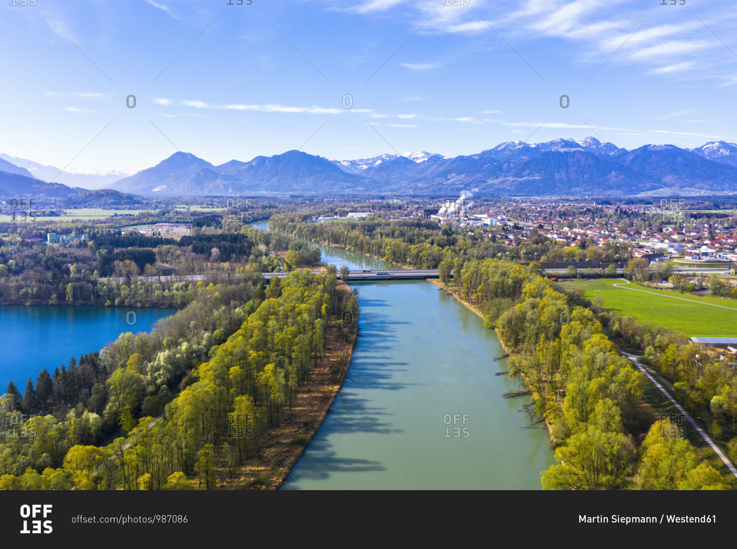 Germany- Bavaria- Raubling- Drone view of river Inn and surrounding town in spring