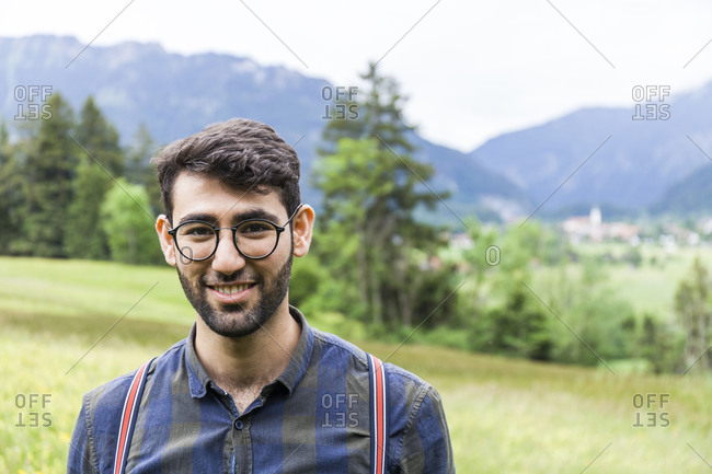 Portrait of smiling young man wearing glasses- Reichenwies- Oberammergau- Gerrmany