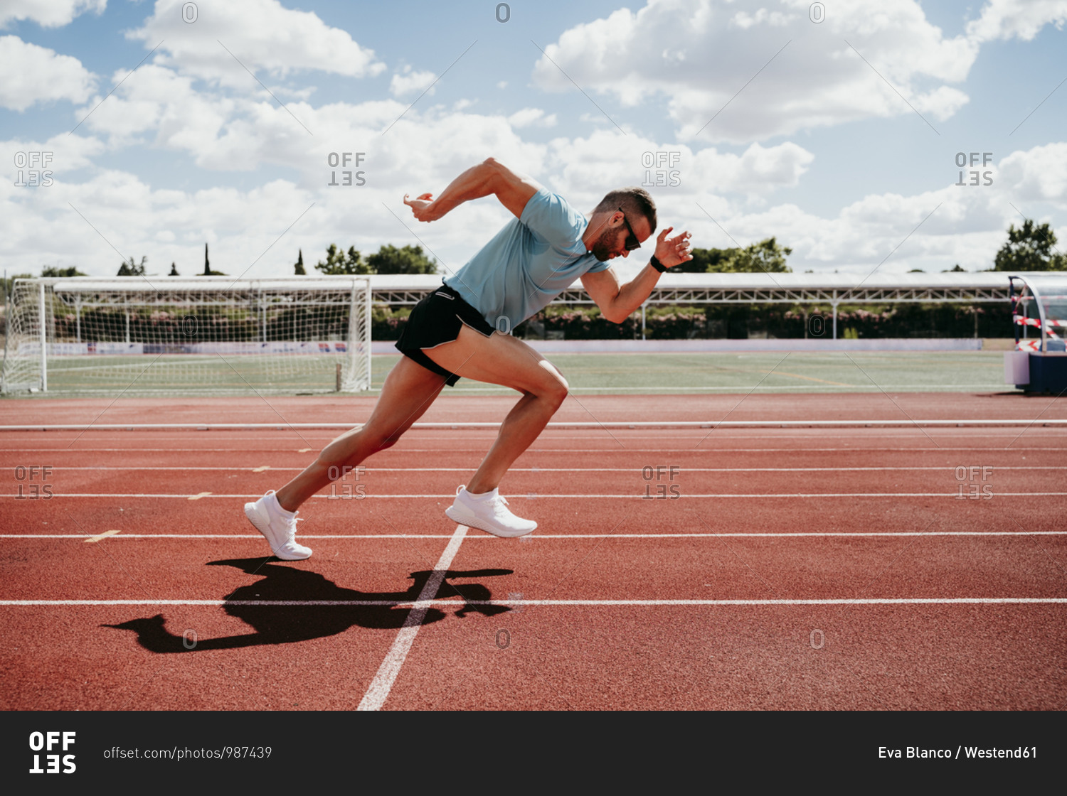 Man running on tartan track