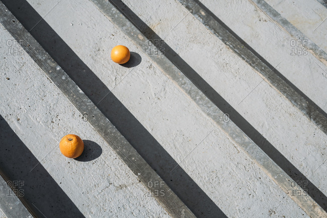 Oranges on gray wood boards