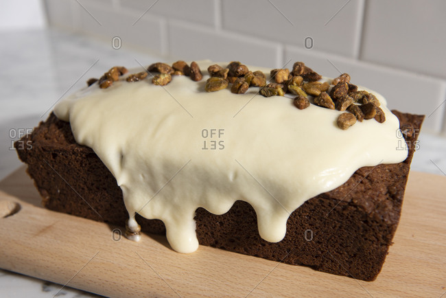 Carrot cake with frosting and pistachios